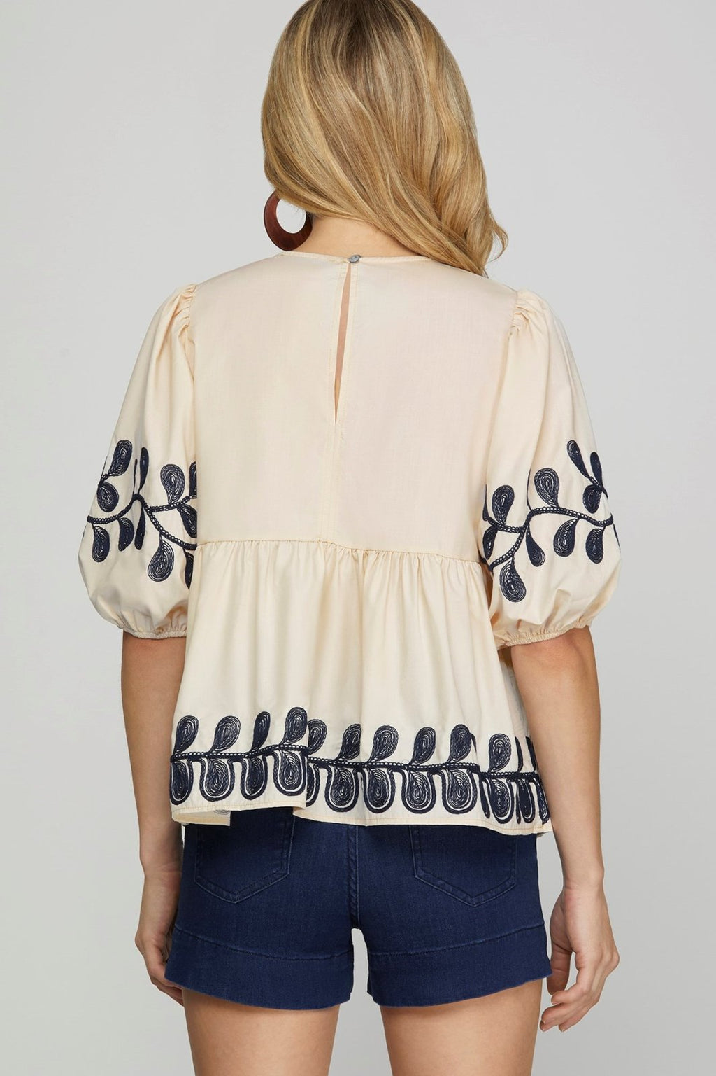 Embroidered light taupe top with navy detailing, perfect for coastal boutique clothing and stylish tops for women.