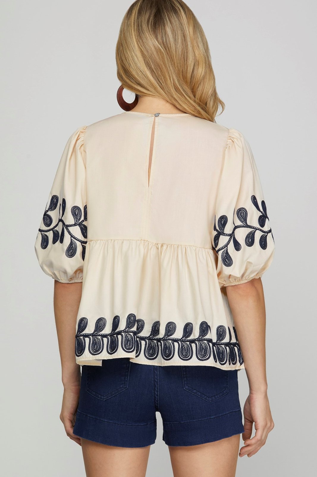 Embroidered light taupe top with navy detailing, perfect for coastal boutique clothing and stylish tops for women.