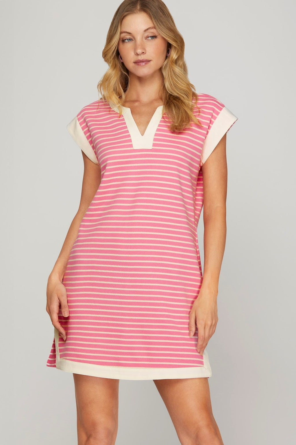 Stylish pink striped Sweetie Dress, perfect for beach days, from a Port Aransas boutique, ideal for tropical vacations.