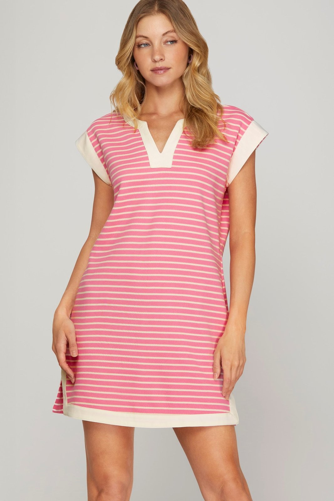Stylish pink striped Sweetie Dress, perfect for beach days, from a Port Aransas boutique, ideal for tropical vacations.