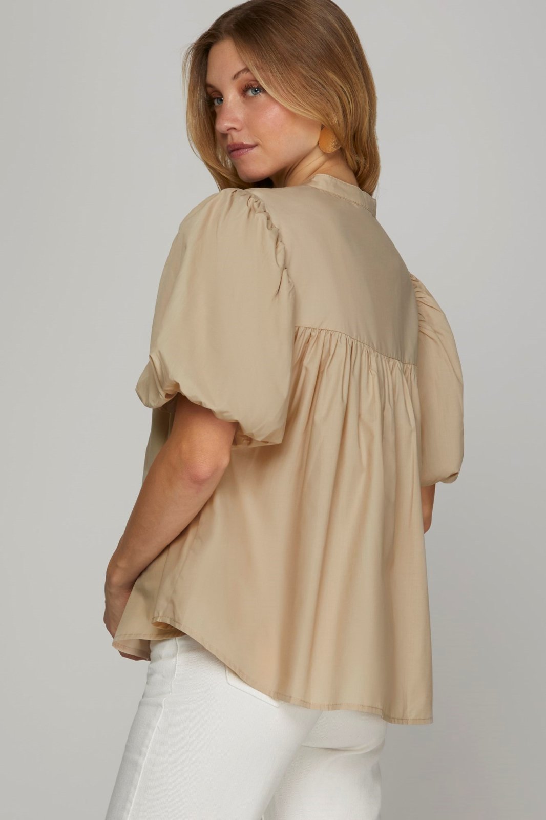 Stylish taupe woven top with puff sleeves, perfect for coastal boutique clothing and tropical vacation dresses.