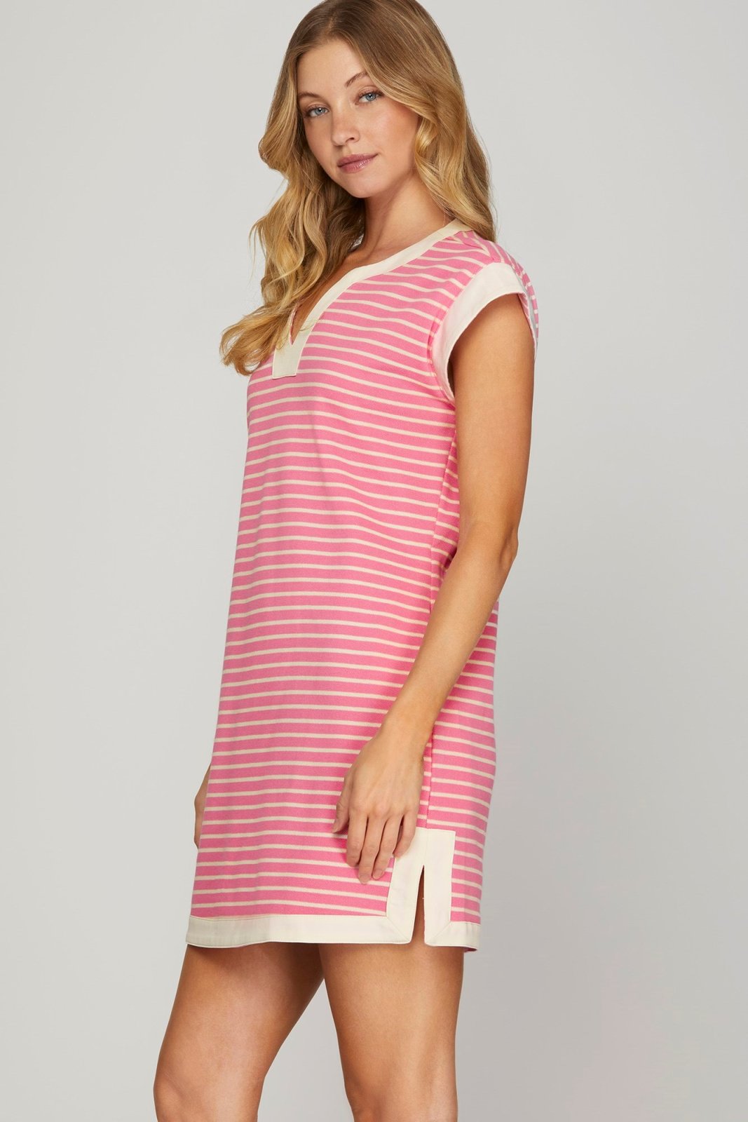 Stylish Sweetie Dress featuring pink stripes, perfect for beach outings and curated women's fashion at a coastal boutique.