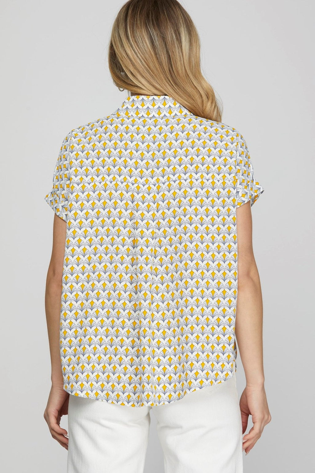 Lois Top from Port Aransas boutique, featuring a stylish yellow and white pattern, perfect for a tropical vacation.