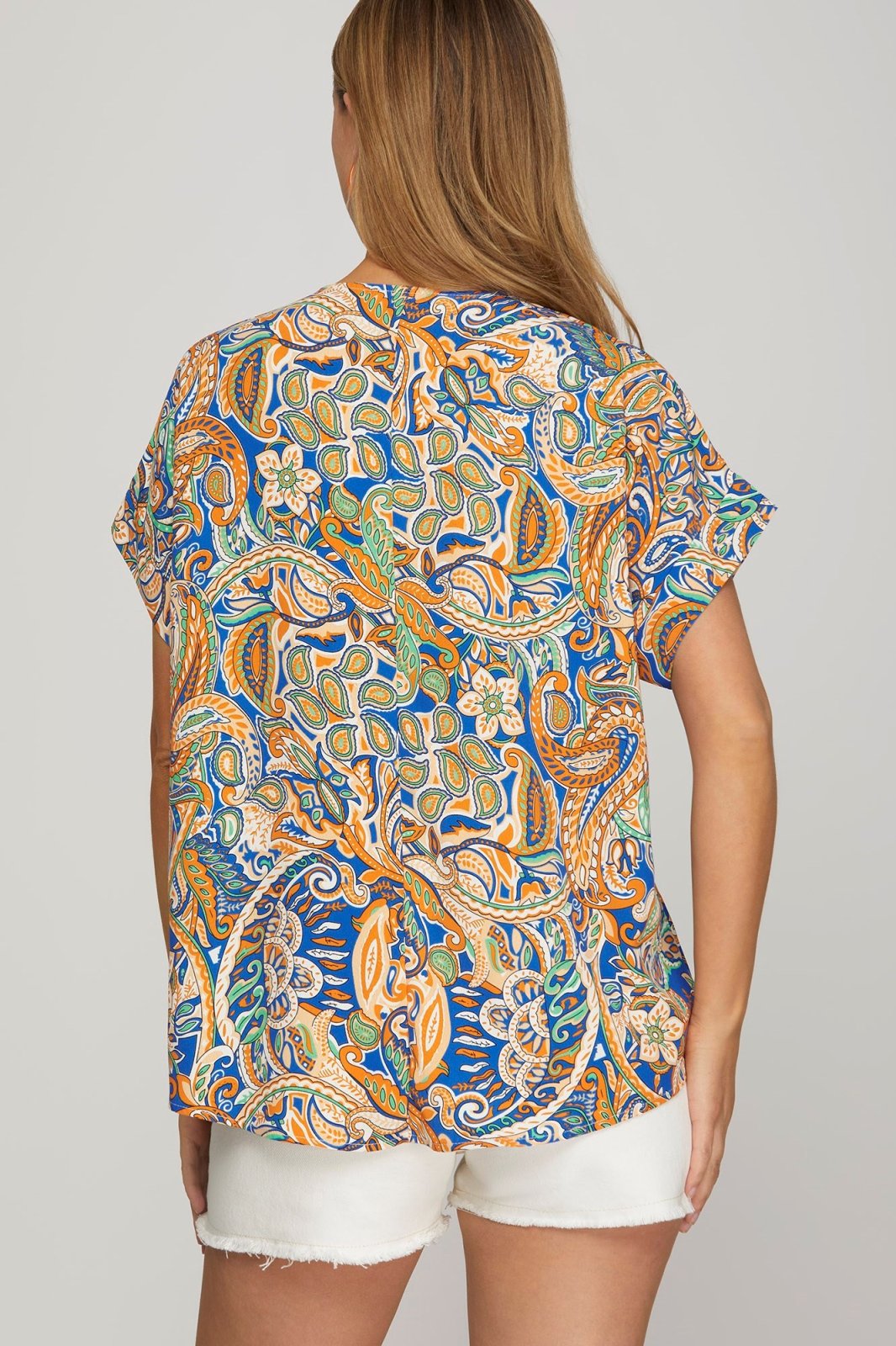 Kathy Top with vibrant woven print, perfect for coastal boutique clothing, pairs well with shorts, stylish tops for women.