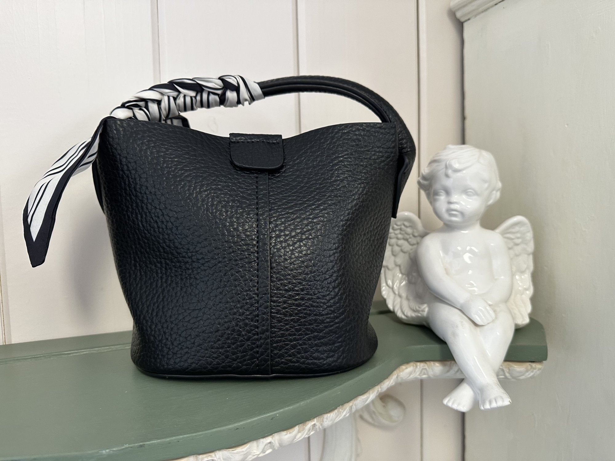 Stylish black Kayleigh Bag with a scarf accent, perfect for coastal boutique clothing and curated women's fashion.