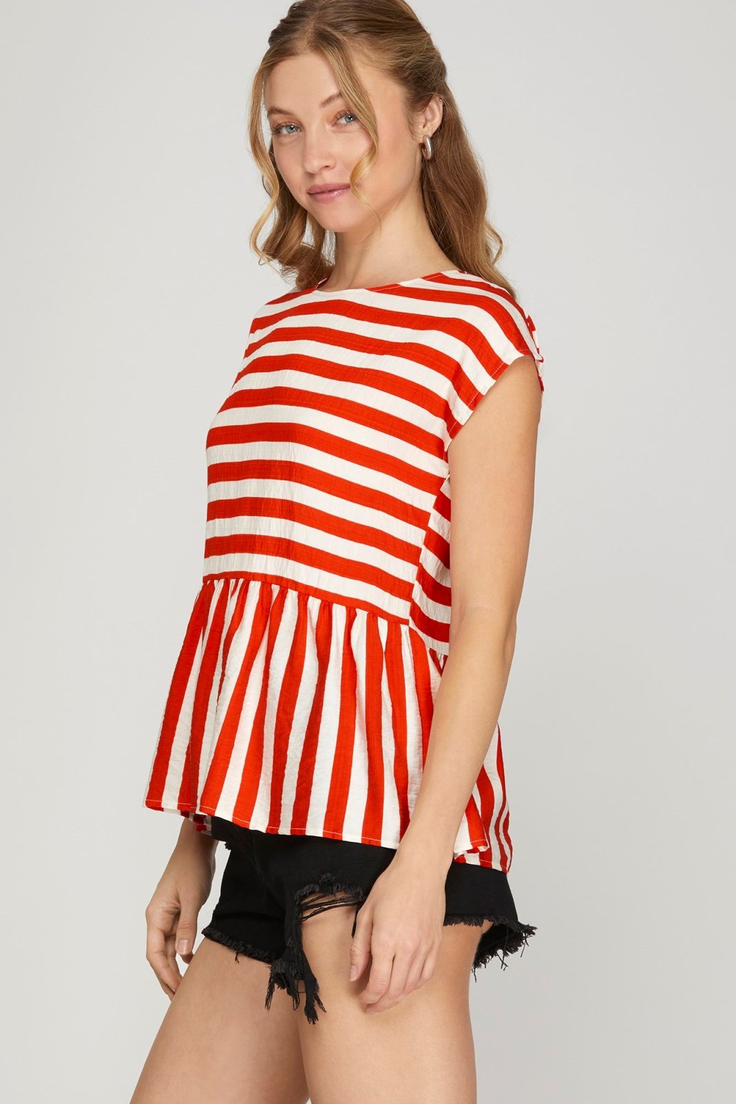 Red striped drop shoulder top featuring a peplum design, perfect for casual outings at coastal boutiques or tropical vacations.