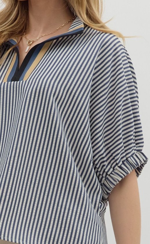 Navy striped Liz Top with high neckline and multicolor rib accent, perfect for trendy coastal style at Raggdoll Boutique.