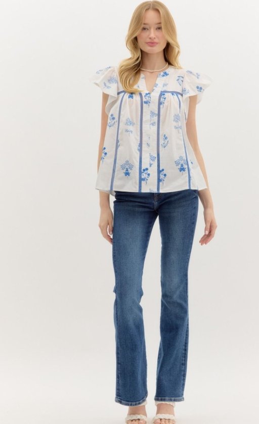 Stylish woman wearing the Scarlet Top in Blue from Raggdoll Boutique, perfect for summer outfits Texas.
