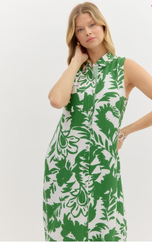 Lucia Dress in green tropical print, sleeveless midi style from Raggdoll Boutique, perfect for summer outfits Texas.