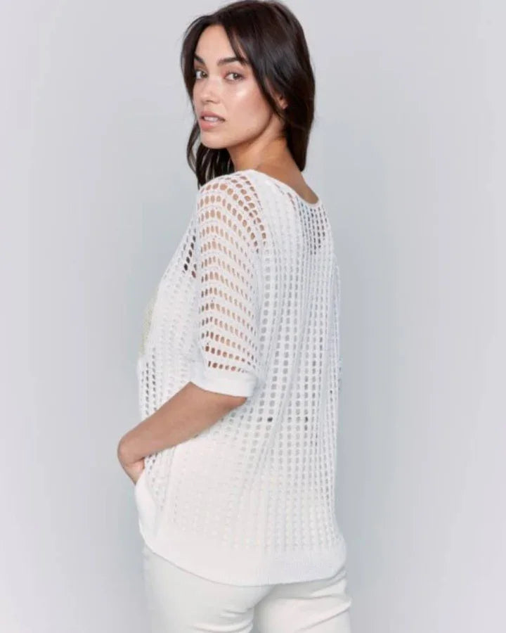 Stylish white fishnet heart sweater featuring V-neck and dolman sleeves from a Port Aransas boutique for women's fashion.