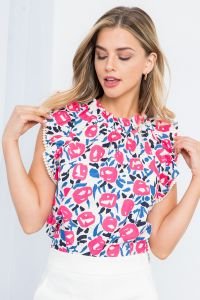 Stylish pink and navy blossom top from a coastal boutique, perfect for beach dresses and tropical vacations.