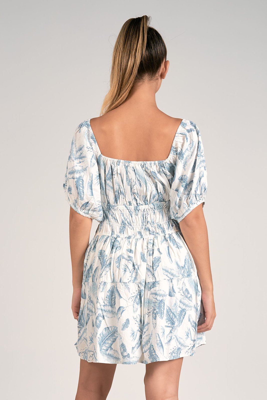 Back view of ELAN BLUE LIMA ROMPER featuring leafy design, perfect for summer outfits Texas at Raggdoll Boutique.