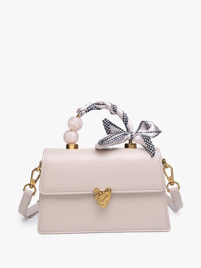 Venice Handbag in Light Beige with pearl and ribbon handle, from Raggdoll Boutique, perfect for trendy coastal style.