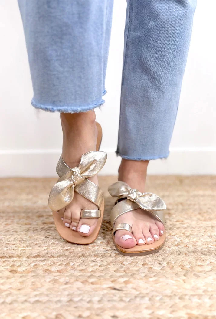 GOLD VAUGHN SLIDE SANDALS BY MATISSE worn with casual jeans for trendy coastal style at Raggdoll Boutique.