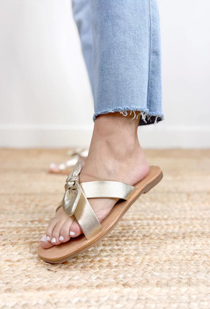 GOLD VAUGHN SLIDE SANDALS BY MATISSE worn with casual jeans, showcasing trendy coastal style, perfect for summer outfits Texas.