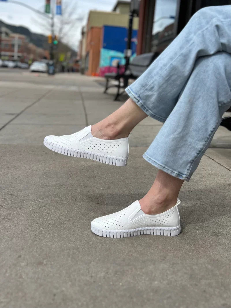 WHITE TULIPS by ILSE JACOBSEN 140 slip-on shoes showcased in a casual outdoor setting.