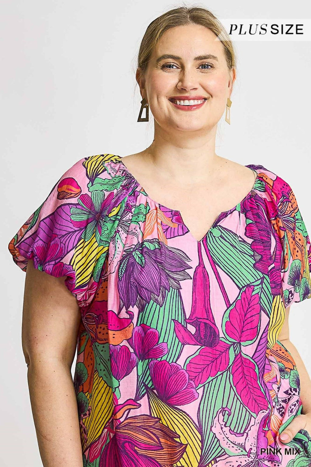 Vibrant plus size tropical floral top with ruffled sleeves, perfect for curvy fashion lovers at Port Aransas boutique.