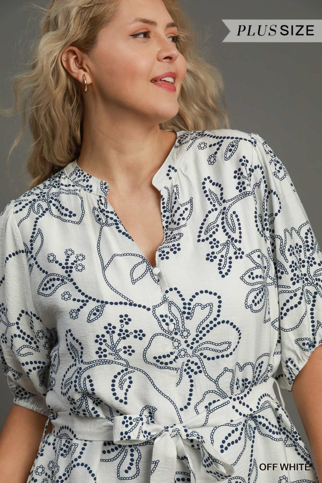 Plus size off white dress with floral pattern, perfect for coastal boutique clothing and a stylish vacation look.