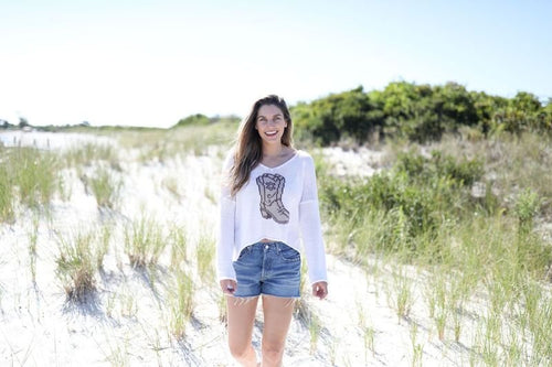Model wearing WS Wooden Ships Boots Sweater-Breaker White, perfect for coastal boutique clothing and tropical vacations.