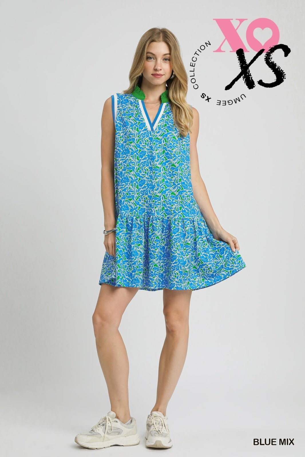 Blue and green sleeveless leaf print dress from a Port Aransas boutique, perfect for tropical vacations and beach outings.