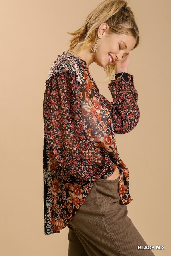 Model wearing FLORAL BLACK MIX TOP showcasing trendy coastal style at Raggdoll Boutique.