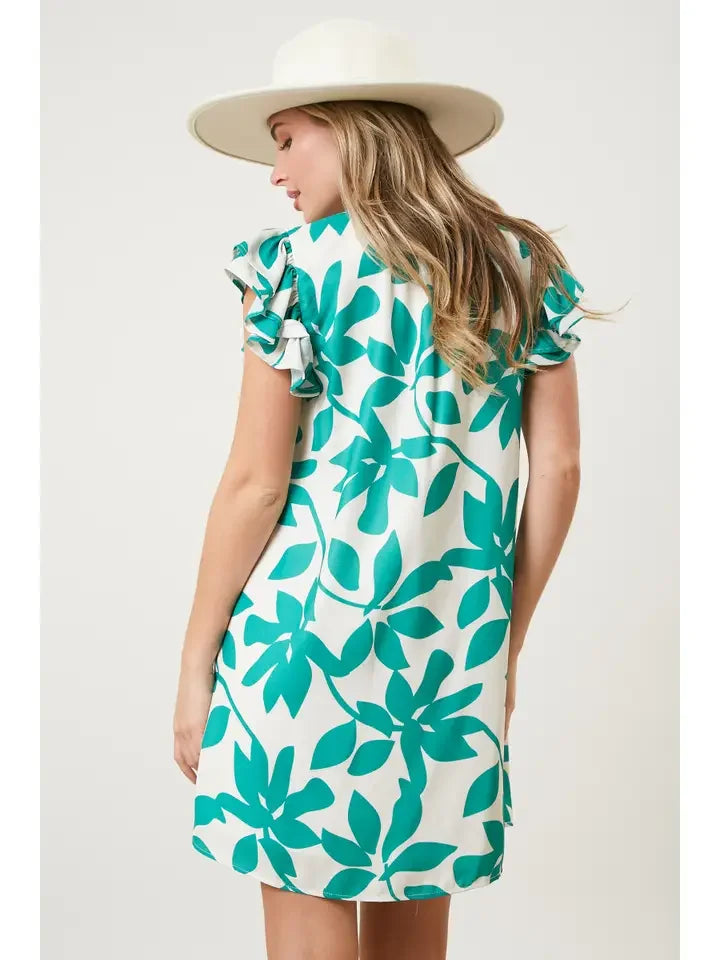 Back view of Anna Dress with teal floral design, perfect for trendy coastal style at Raggdoll Boutique.