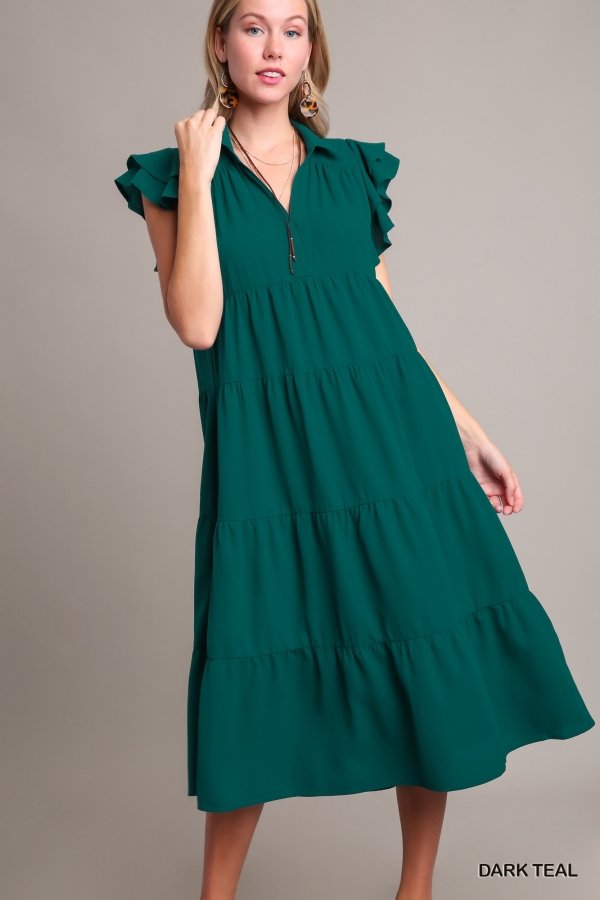 Dark teal tiered dress with ruffle sleeves, perfect for coastal boutique clothing and tropical vacation outfits.