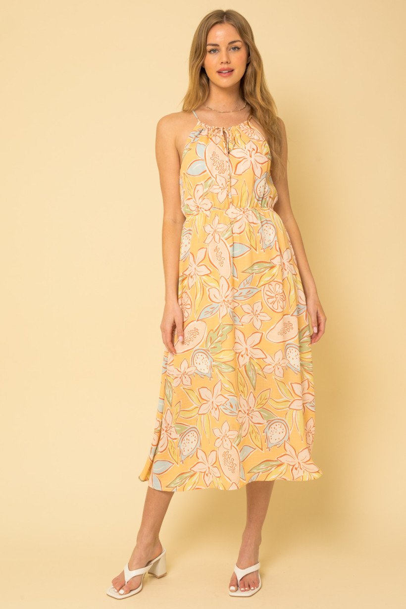 FLOWERS! YELLOW FLORAL HALTER DRESS from Raggdoll Boutique, perfect for summer outfits Texas and coastal fashion.