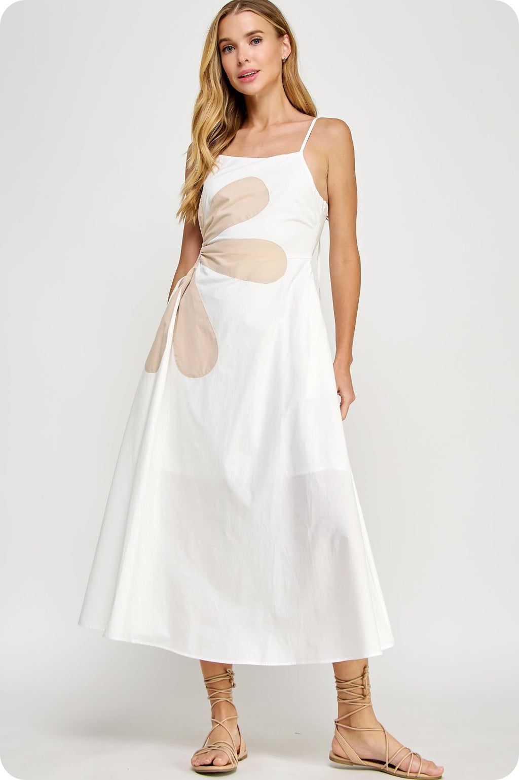 Addison Dress: Off-white maxi with side cutout, perfect for tropical vacations. From a coastal boutique for curated women's fashion.