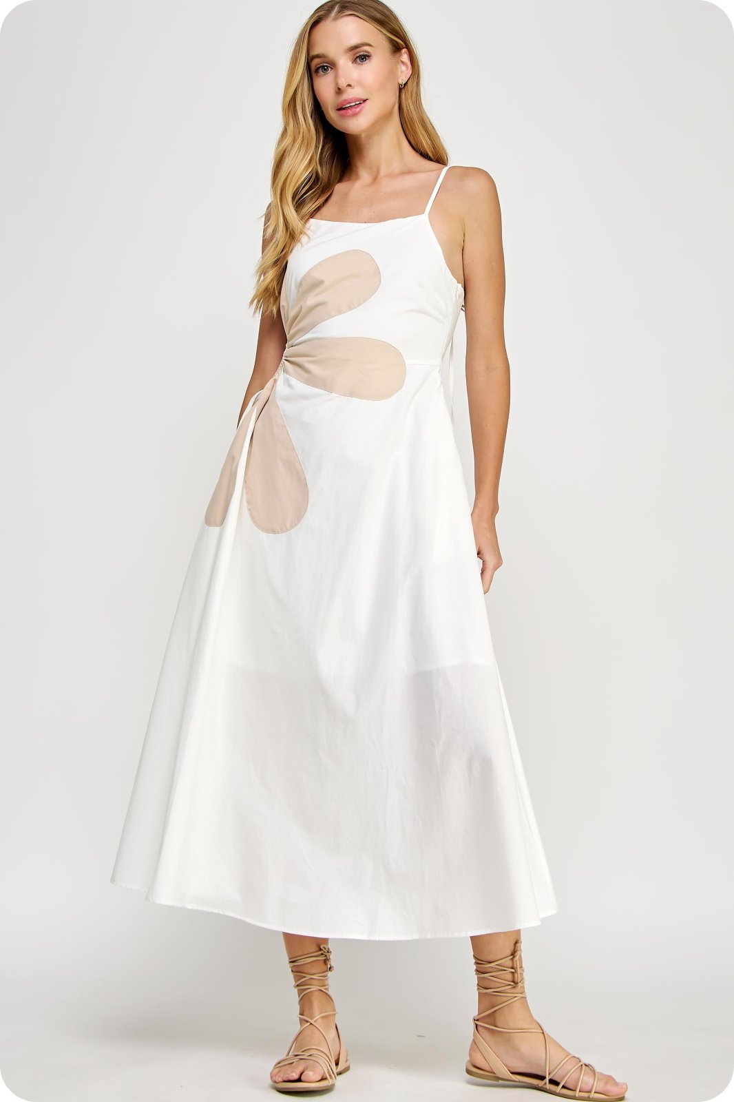 Addison Dress: Off-white maxi with side cutout, perfect for tropical vacations. From a coastal boutique for curated women's fashion.