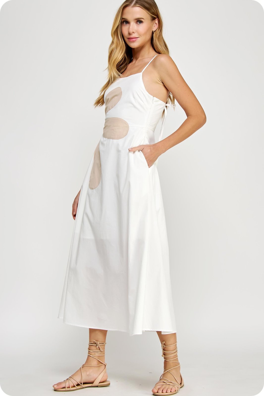 Off-white sleeveless maxi dress with side cutout and patchwork detail, perfect for coastal boutique clothing and beach style.