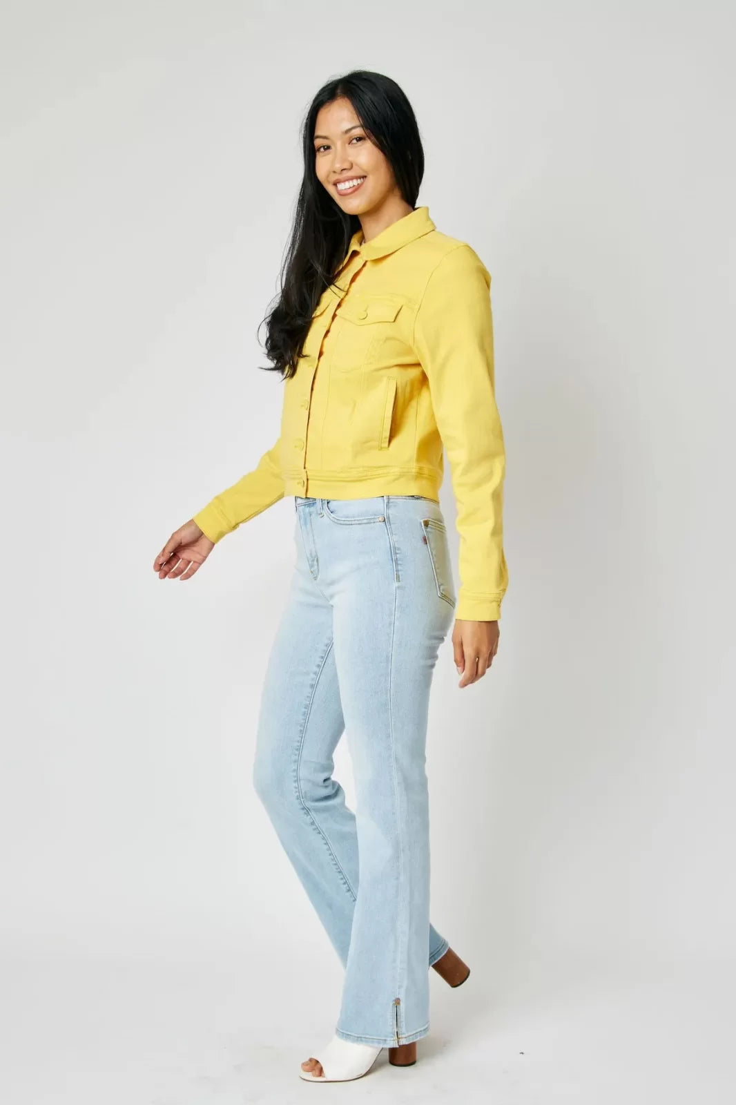 Model showcasing JUDY BLUE YELLOW DYED DENIM JACKET from Raggdoll Boutique in Port Aransas, perfect for vacation wardrobe.