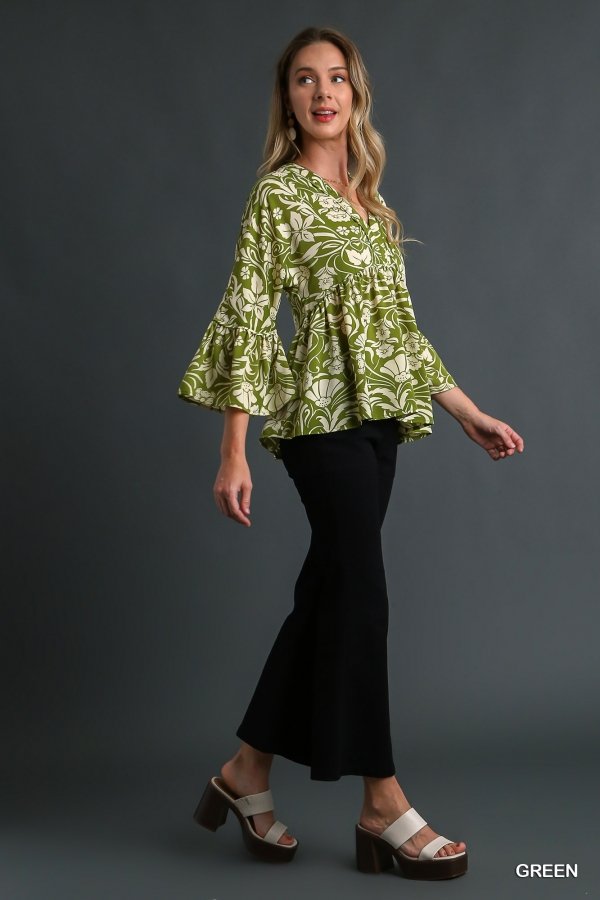 Stylish model wearing a GREEN AND CREAM TOP, perfect for summer outfits at Raggdoll Boutique.