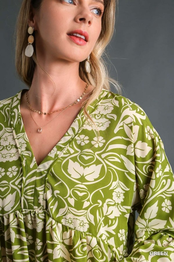 Fashion model showcasing the GREEN AND CREAM TOP from Raggdoll Boutique, perfect for trendy coastal style.