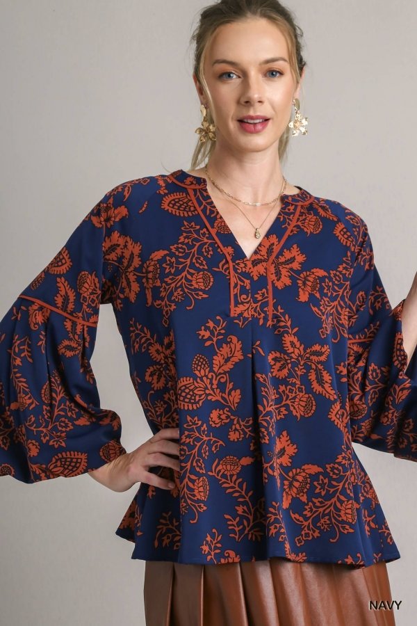 Navy orange printed top from Raggdoll Boutique, a trendy addition to summer outfits Texas and coastal fashion boutique.