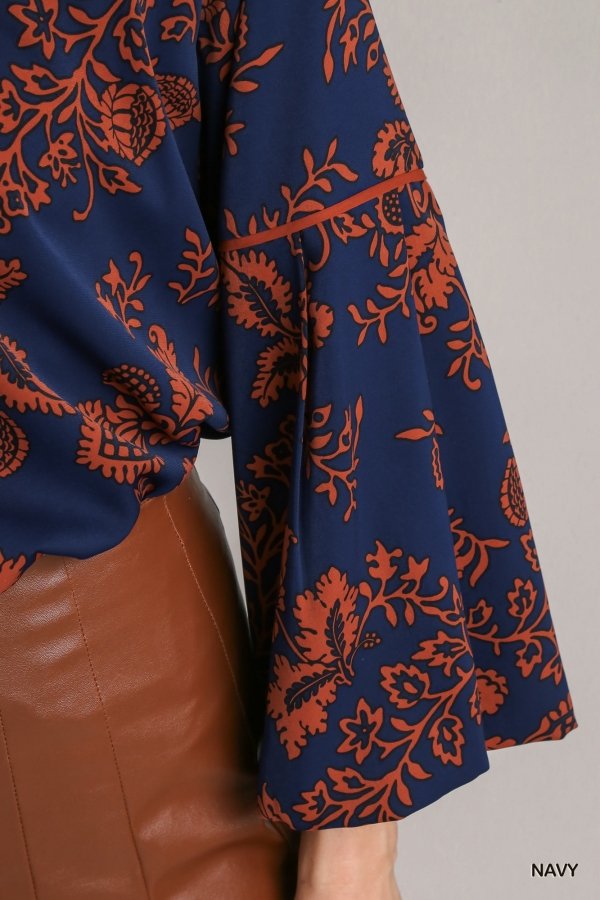 NAVY ORANGE PRINTED TOP showcasing floral design in navy and rust, from Raggdoll Boutique, perfect for trendy coastal style.