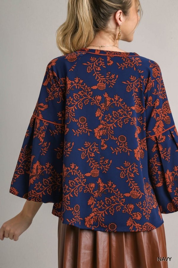 Navy orange printed top from Raggdoll Boutique, perfect women’s clothing for trendy coastal style.