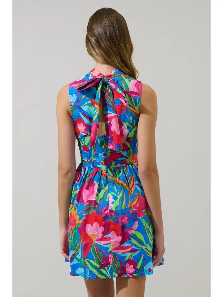 Back view of Naima Floral Hansen Mini Dress showcasing vibrant floral print, ideal for coastal boutique clothing and beach dresses.