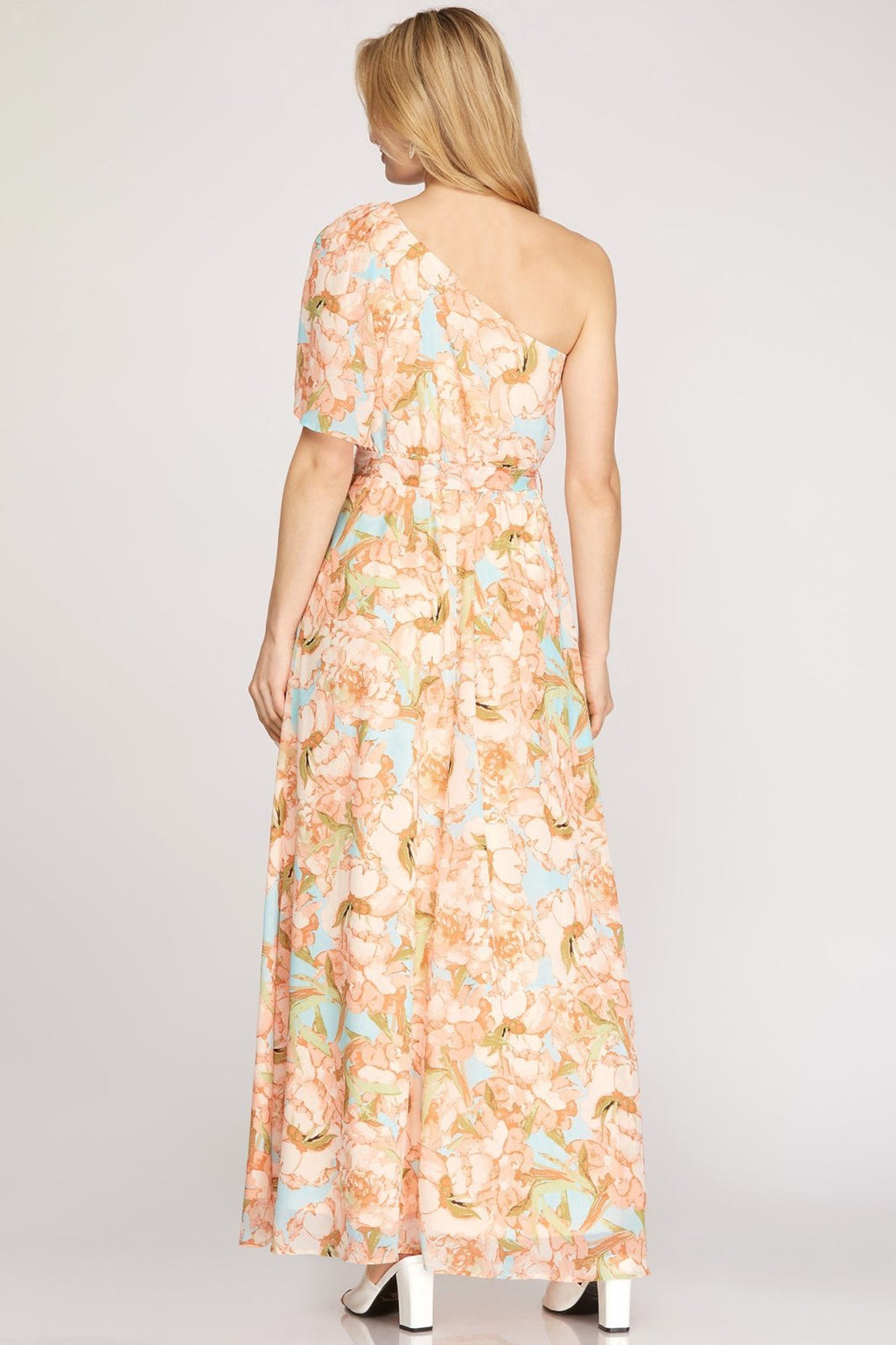 Back view of the PEACHES N' CREME DRESS from Raggdoll Boutique, showcasing its floral print and one-shoulder design.