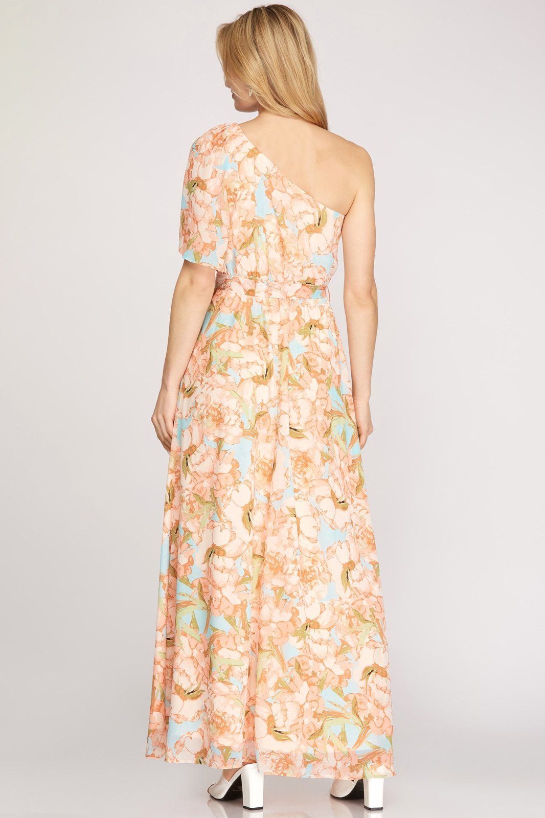 Back view of the PEACHES N' CREME DRESS from Raggdoll Boutique, showcasing its floral print and one-shoulder design.