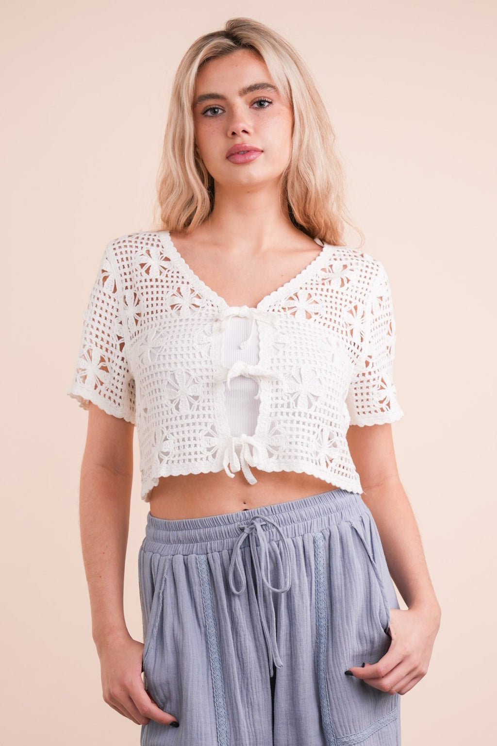Crochet casual crop top with front ties, perfect for coastal boutique clothing and summer styles.