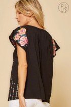 PLUS BLACK EMBROIDERED SAVANNA JANE TOP showing floral embroidery and lace details, perfect for vacation wardrobe boutique.