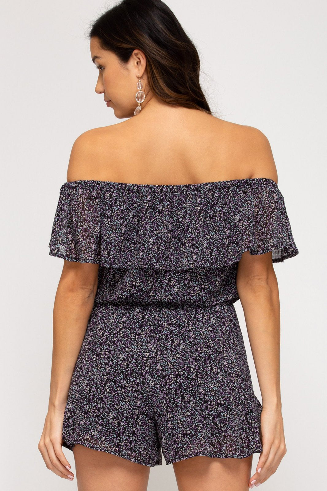 BLACK FLORAL OFF-SHOULDER ROMPER worn by model, showcasing trendy coastal style from Raggdoll Boutique.