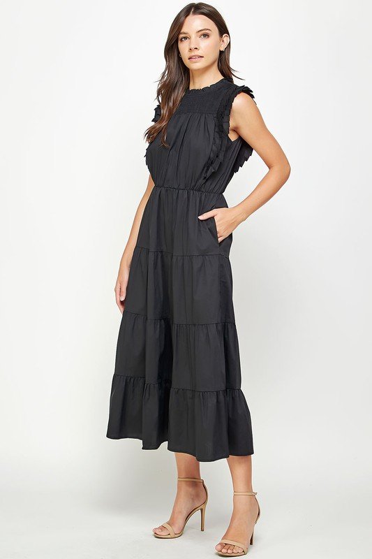 Beautiful black tiered pleat midi dress from Raggdoll Boutique, perfect for summer outfits in Texas and vacation wardrobes.
