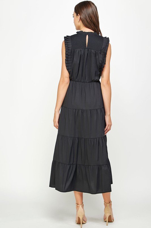 Beautiful black tiered pleat midi dress with ruffled sleeves, perfect for summer outfits Texas from Raggdoll Boutique.