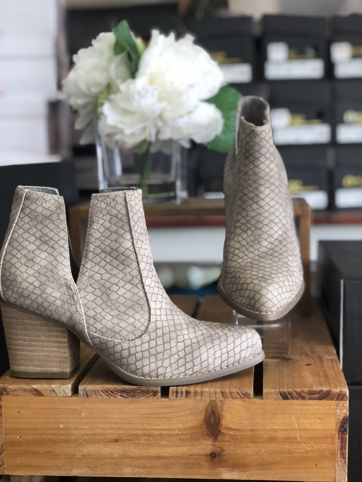 TARIM TAUPE BOOTIE displayed on a wooden platform, featuring trendy coastal style from Raggdoll Boutique.