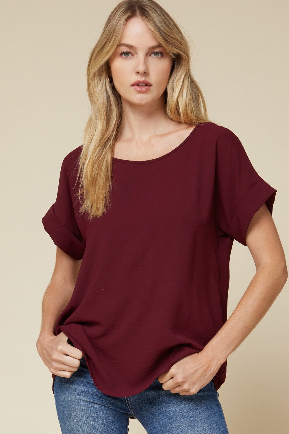 SIMPLE SCOOP NECK TOP-BURGUNDY stylishly paired with jeans, featuring rolled sleeves and a flattering fit.