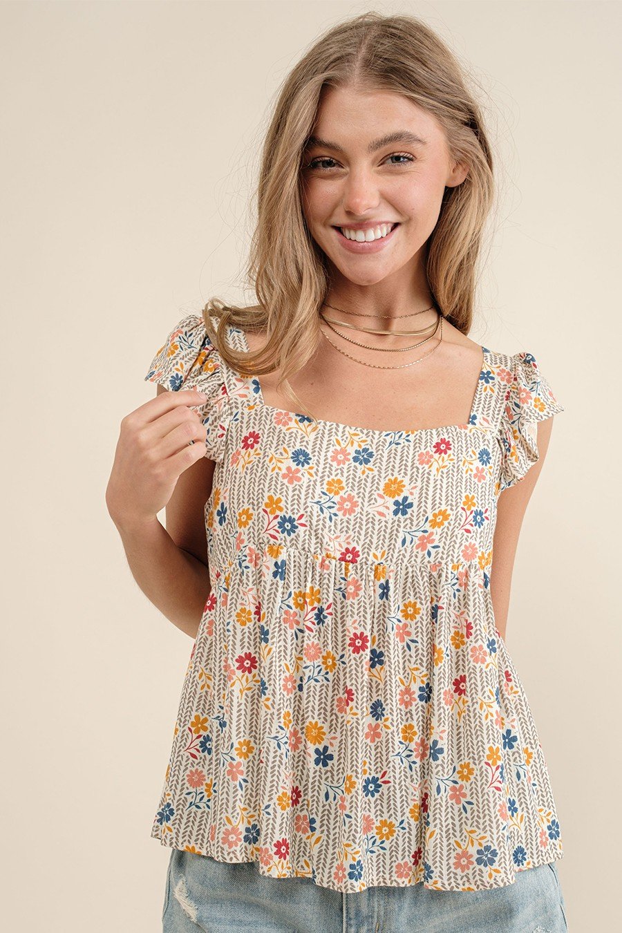 Floral ruffle top from a coastal boutique, ideal for beach outings or tropical vacations, perfect for curvy women's fashion.