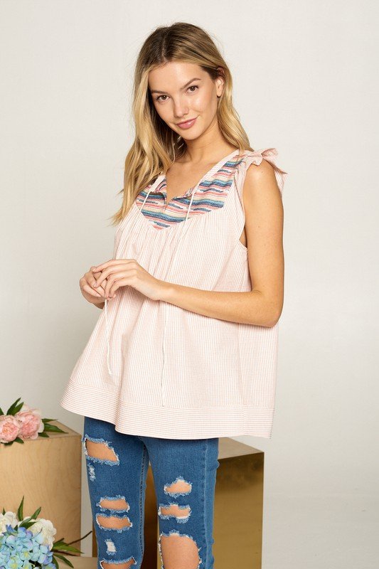 CORAL SEER SUCKER TOP WITH EMBROIDERY from Raggdoll Boutique, perfect for summer outfits Texas and trendy coastal style.