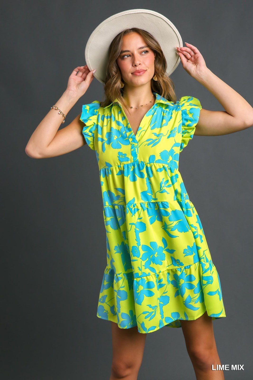 In the Lime Light Dress featuring vibrant floral patterns, perfect for summer outfits Texas from Raggdoll Boutique.